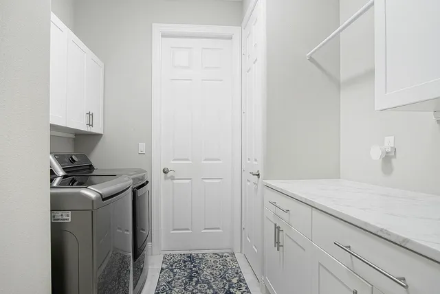 a kitchen with a stove and a refrigerator