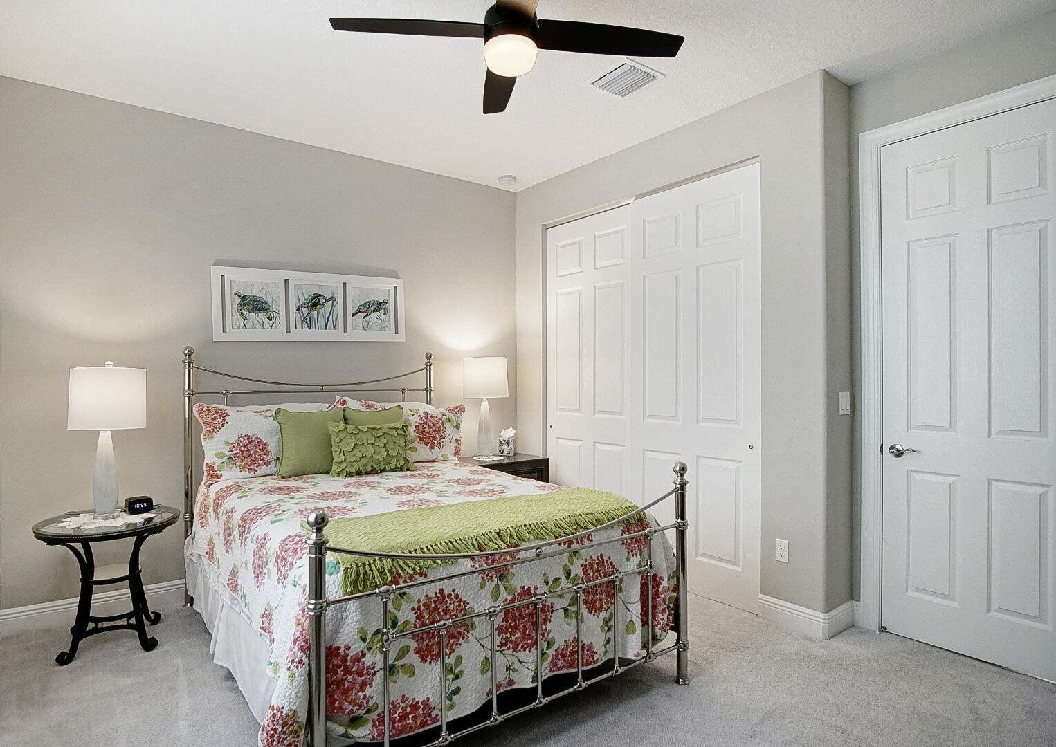 2652 Conifer Drive Fort Pierce, FL 34951 - Photo 30 of 45 a bedroom with a bed and a chandelier