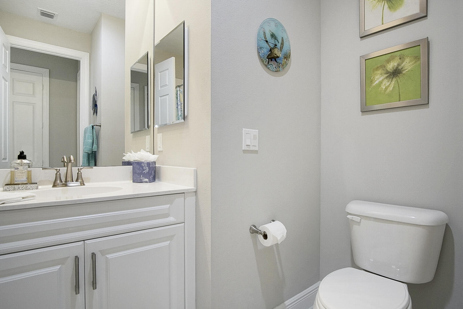 2652 Conifer Drive Fort Pierce, FL 34951 - Photo 32 of 45 a bathroom with a toilet sink and mirror