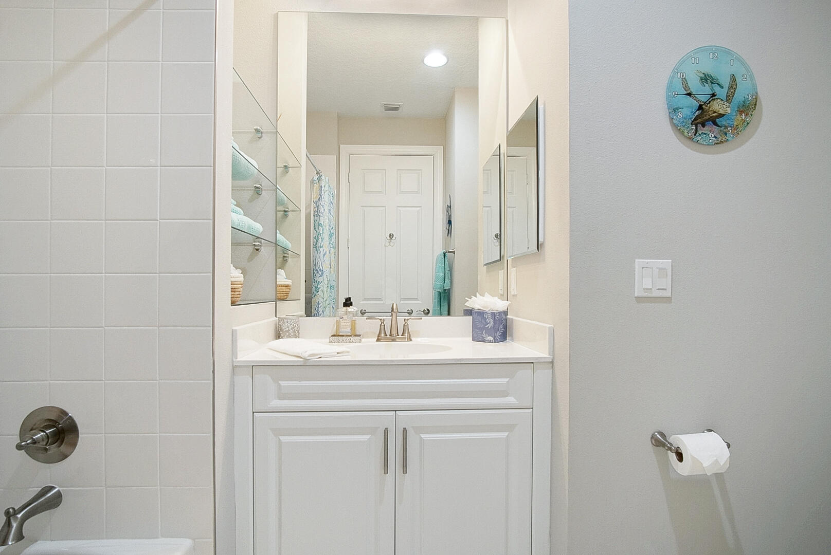2652 Conifer Drive Fort Pierce, FL 34951 - Photo 33 of 45 a bathroom with a sink a mirror and a toilet