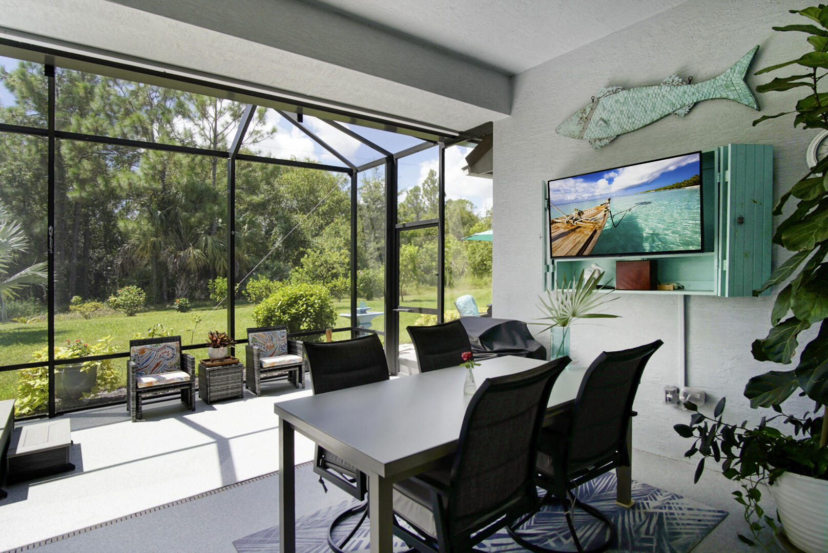 2652 Conifer Drive Fort Pierce, FL 34951 - Photo 35 of 45 a view of a dining room with furniture large windows and wooden floor