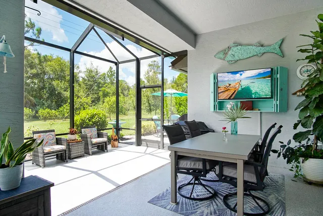 a view of a dining room with furniture window and outside view
