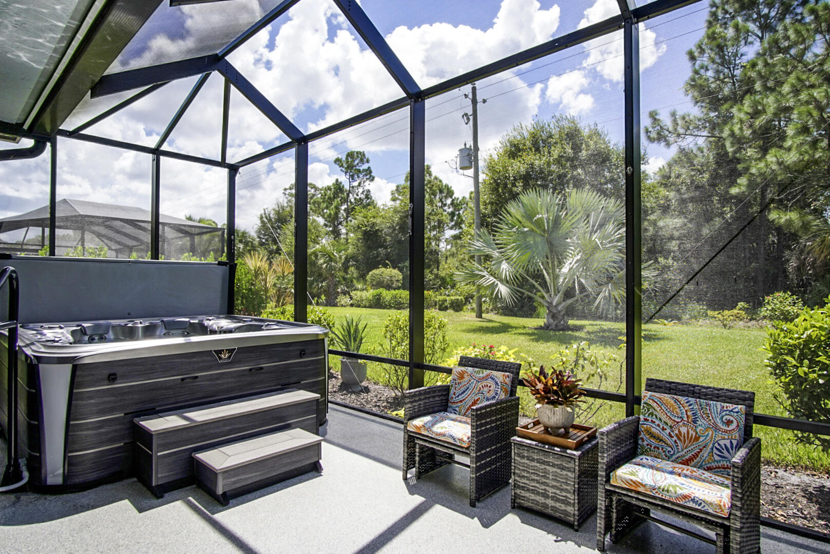 2652 Conifer Drive Fort Pierce, FL 34951 - Photo 38 of 45 a living room with furniture and a floor to ceiling window