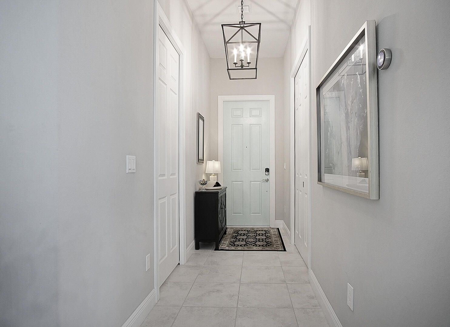 2652 Conifer Drive Fort Pierce, FL 34951 - Photo 4 of 45 a view of a hallway with wooden floor and staircase