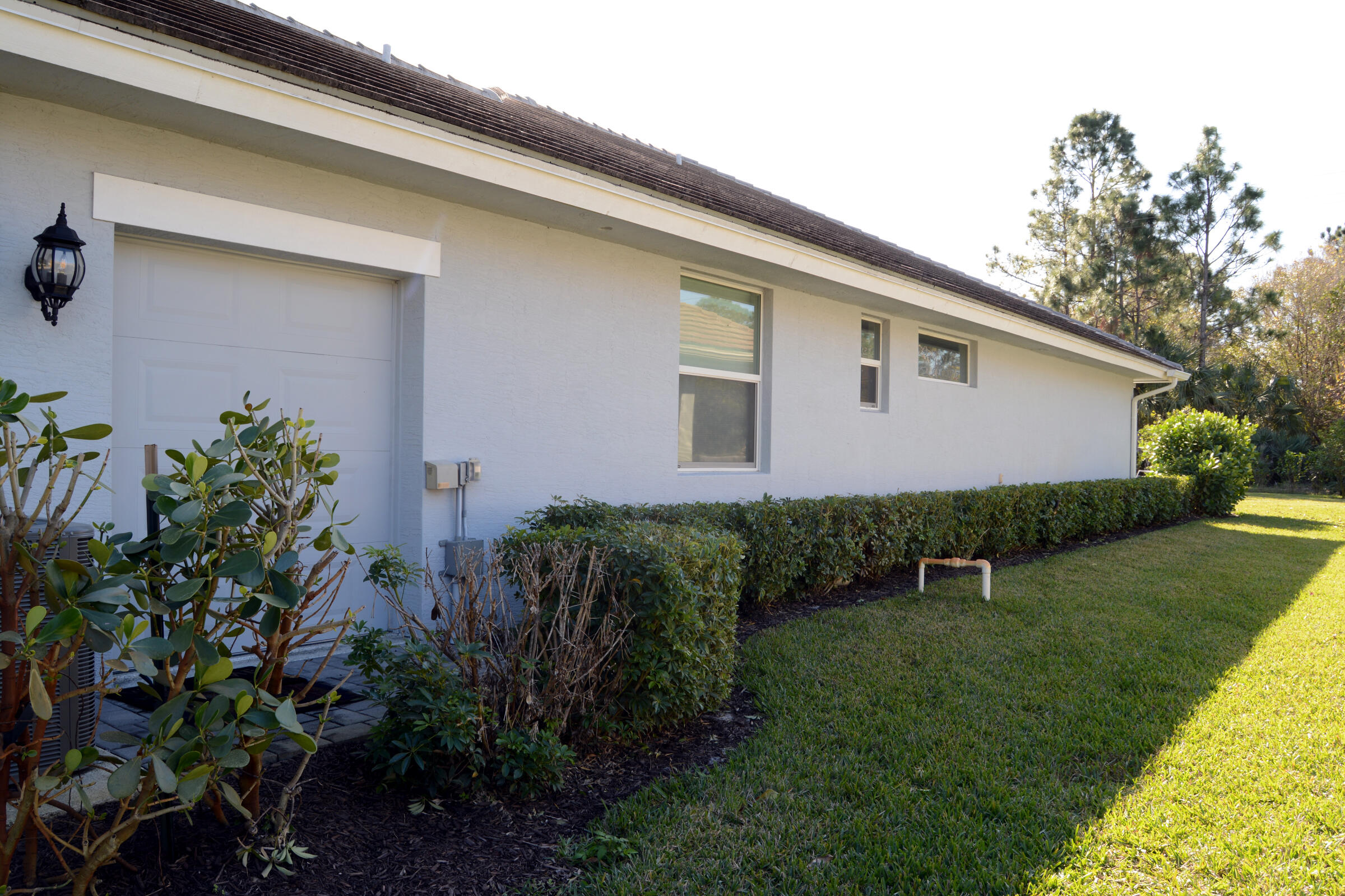 2652 Conifer Drive Fort Pierce, FL 34951 - Photo 42 of 45 a backyard of a house with lots of green space