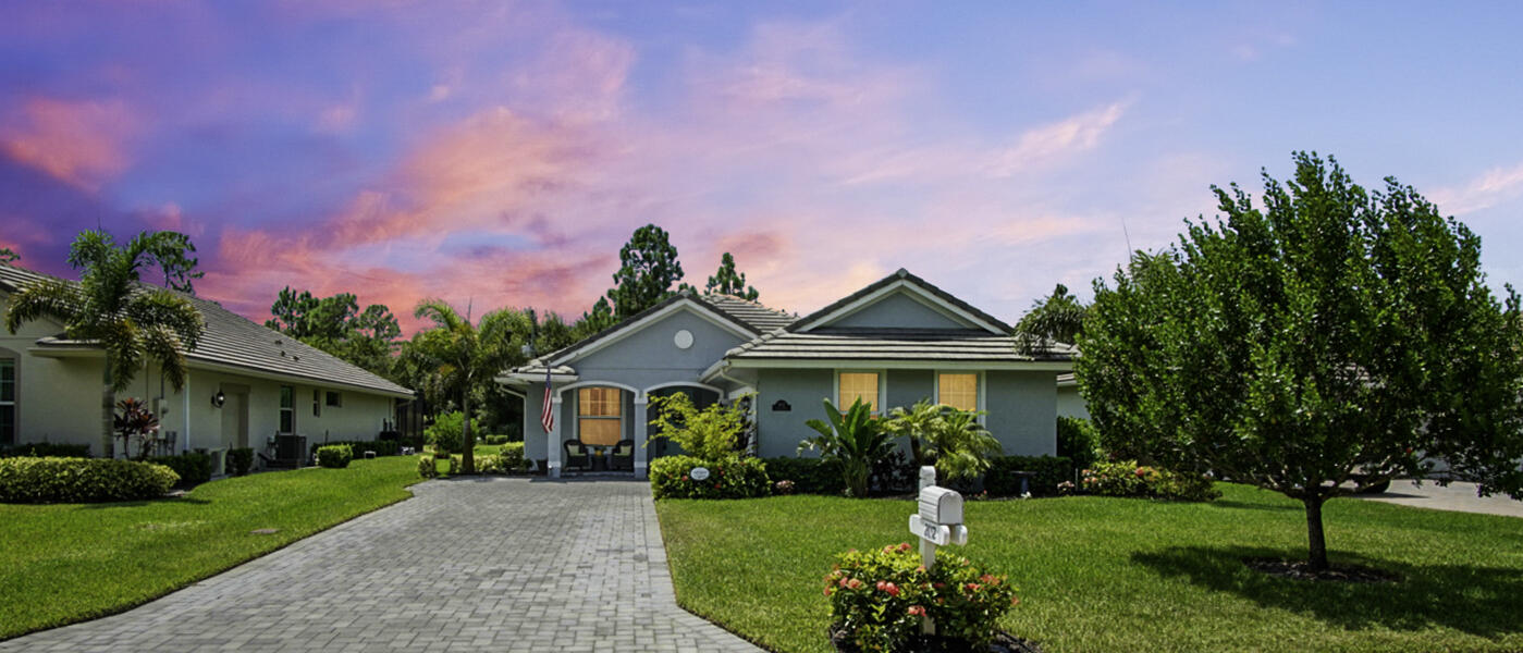 2652 Conifer Drive Fort Pierce, FL 34951 - Photo 44 of 45 a front view of a house with a garden and plants