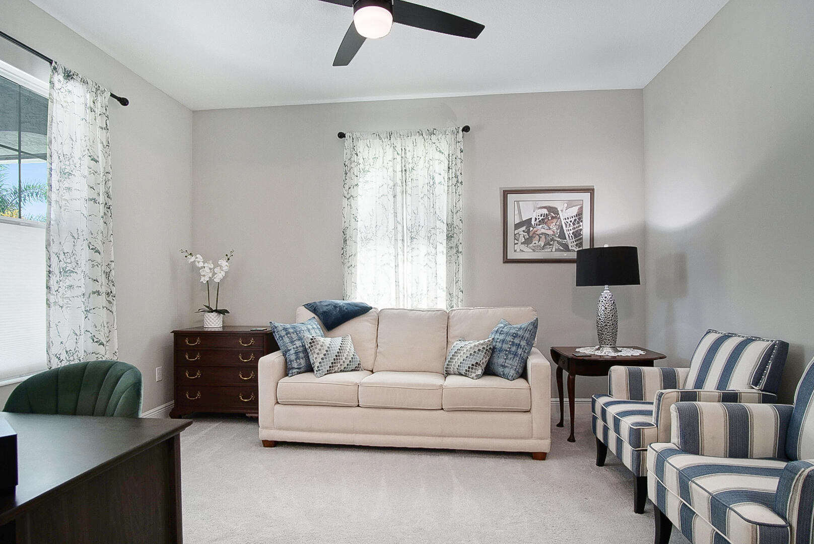 2652 Conifer Drive Fort Pierce, FL 34951 - Photo 5 of 45 a living room with furniture and a chandelier