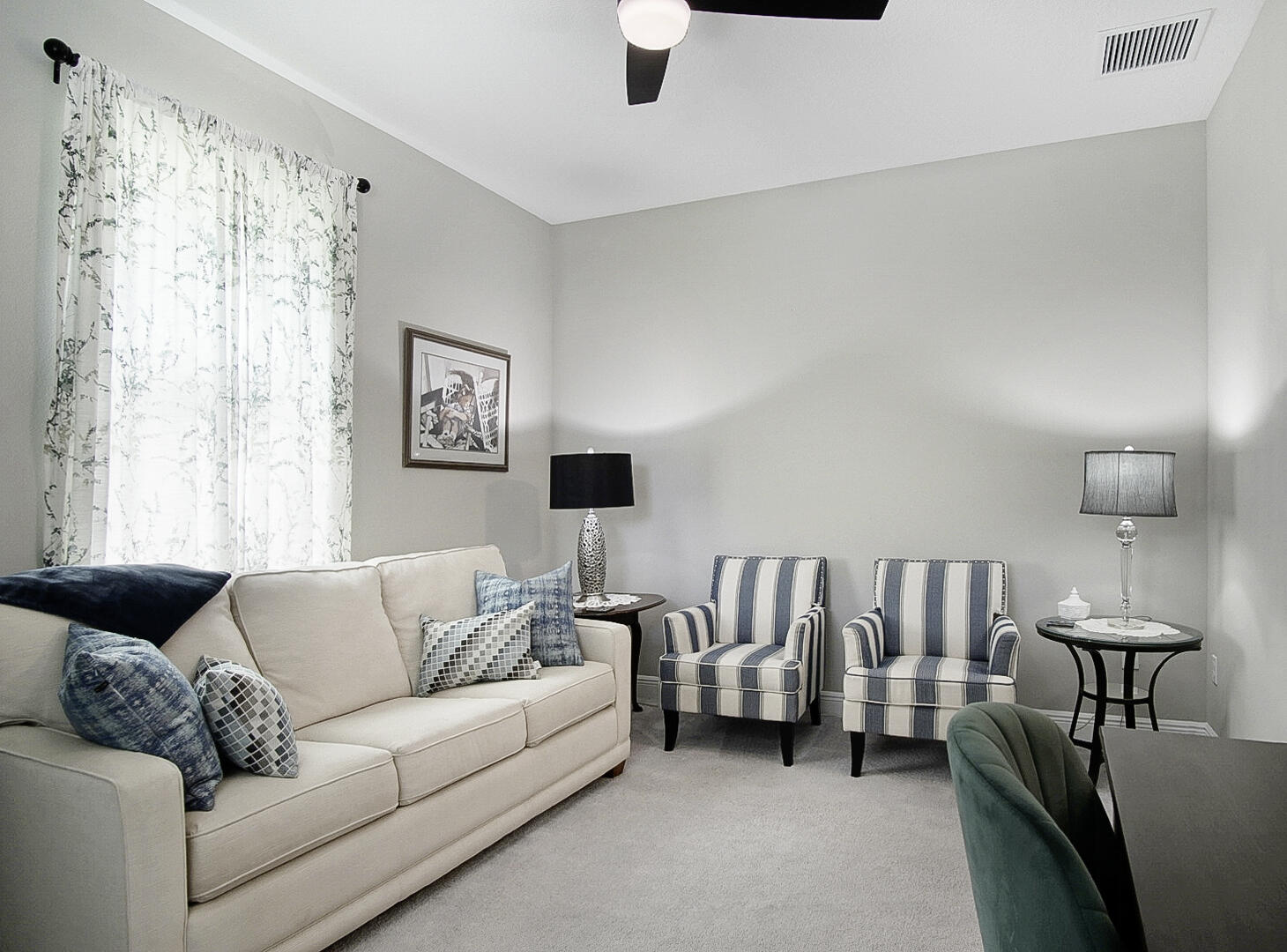 2652 Conifer Drive Fort Pierce, FL 34951 - Photo 6 of 45 a living room with furniture and a large window