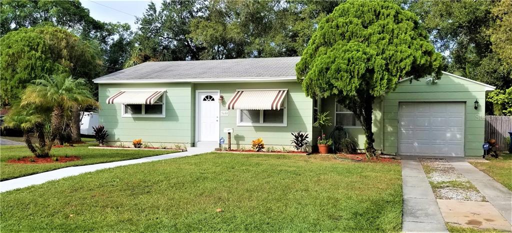 Simply Adorable home on Huge Corner Lot!  Note the 1 car garage!