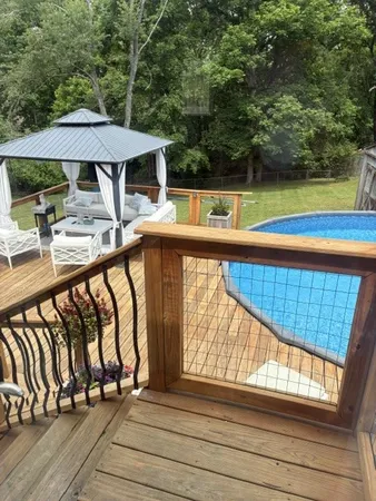 a view of swimming pool with seating area