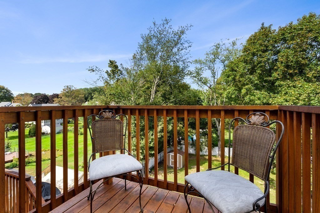129 Friend Street Amesbury, MA 01913 - Photo 14 of 37 a balcony with wooden floor table and chairs