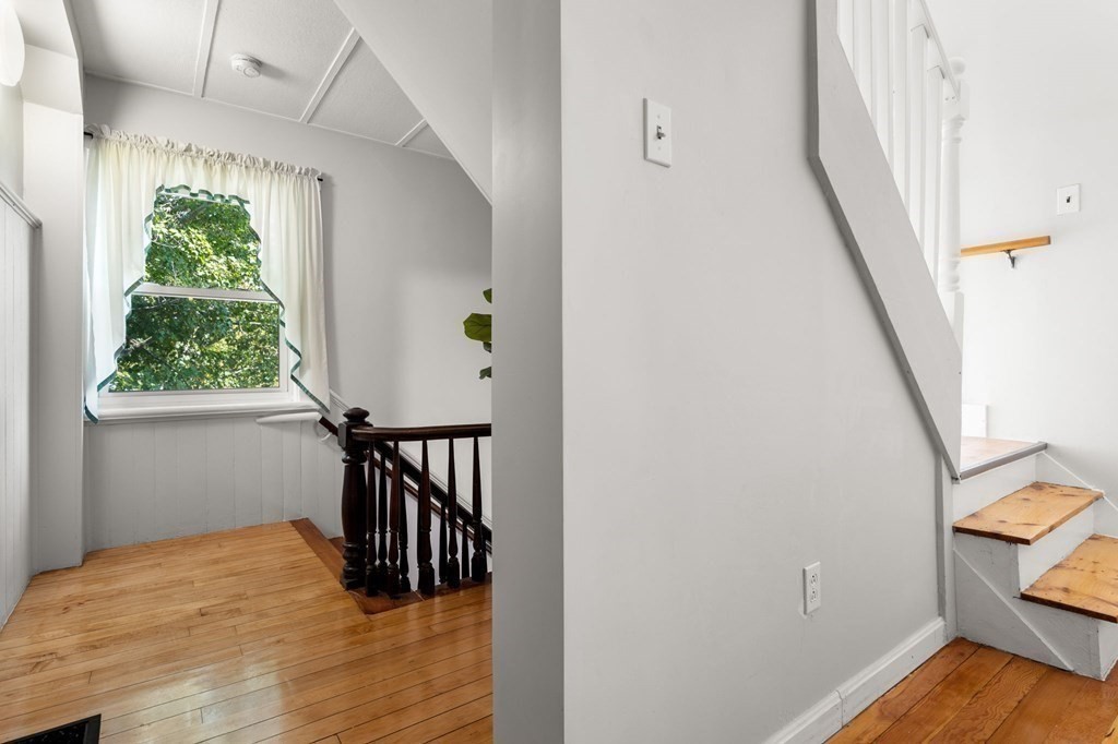 129 Friend Street Amesbury, MA 01913 - Photo 15 of 37 a view of a hallway with wooden floor and entryway