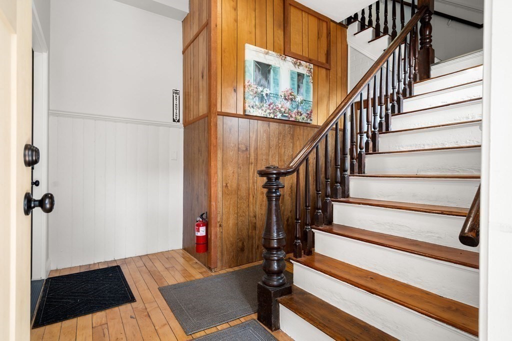 129 Friend Street Amesbury, MA 01913 - Photo 16 of 37 a view of staircase with white walls and a window