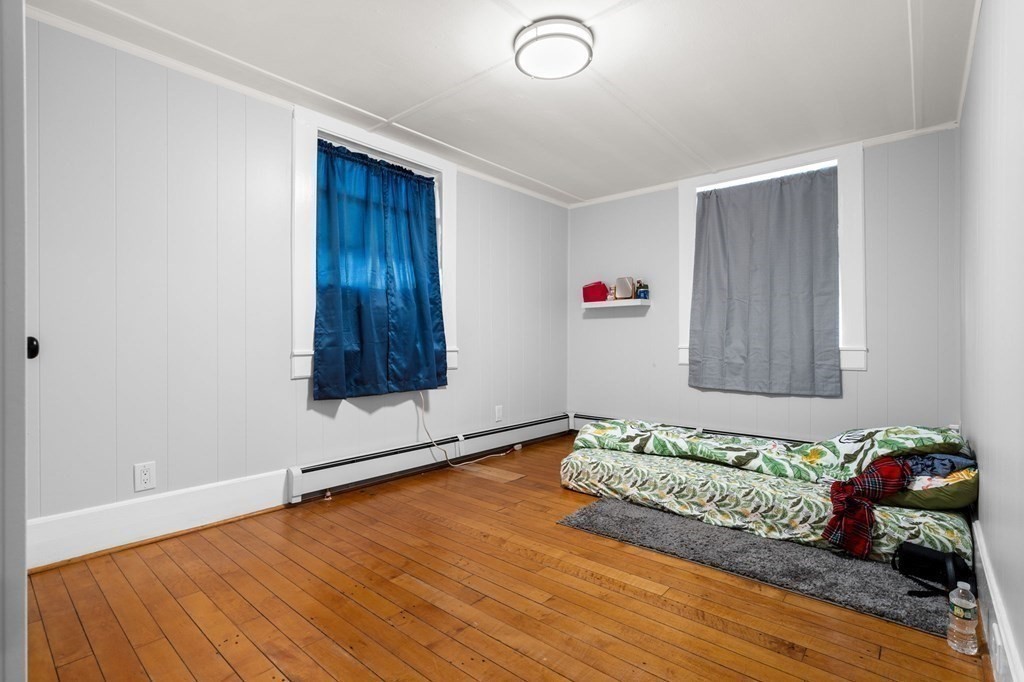 129 Friend Street Amesbury, MA 01913 - Photo 19 of 37 a room with toys and wooden floor