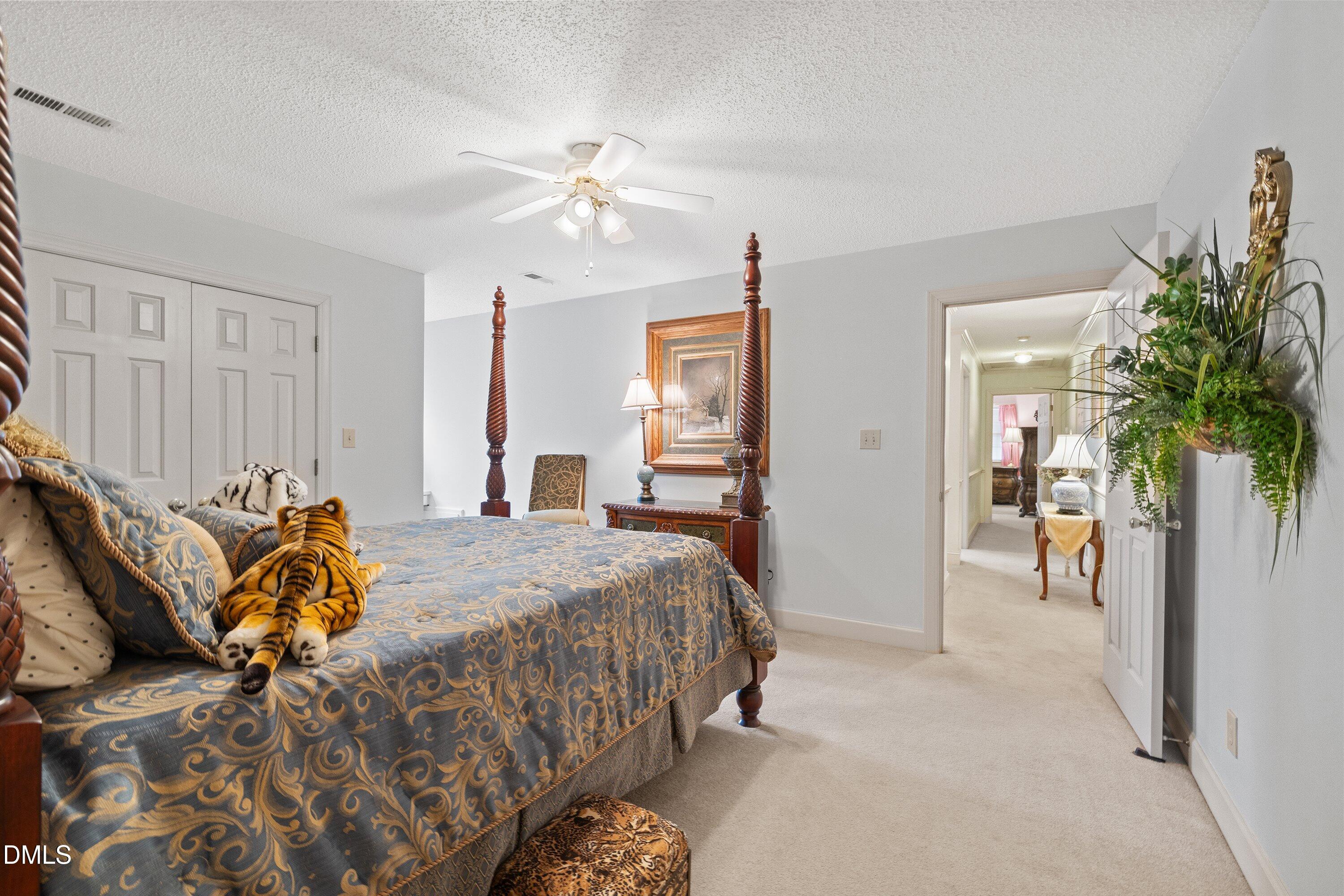 6314 Old Davis Road Sims, NC 27880 - Photo 46 of 71 a bedroom with a bed and a chandelier