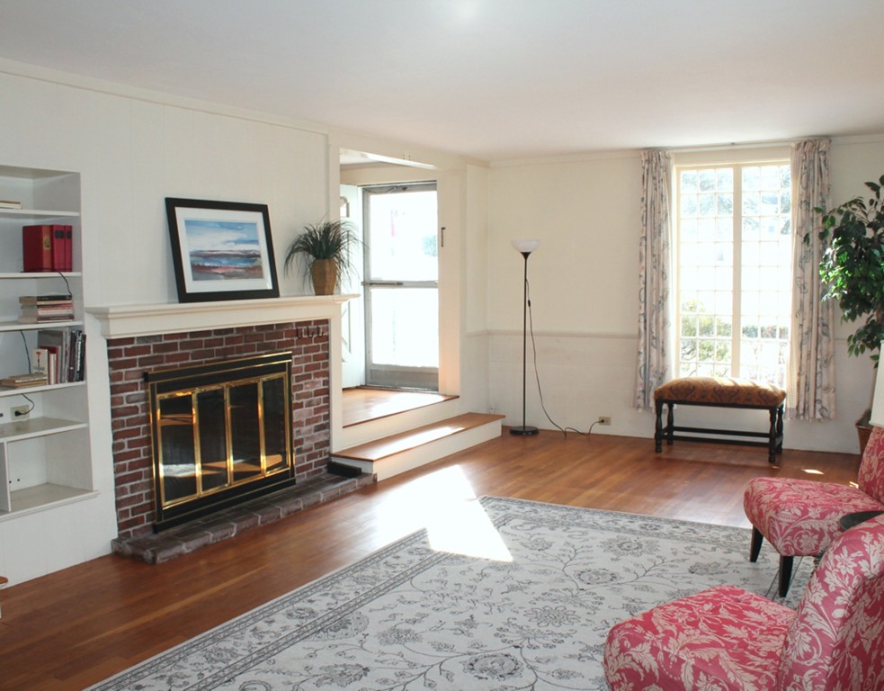 100 Simonds Road Lexington, MA 02420 - Photo 3 of 20 a living room with furniture and a fireplace