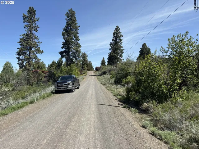 a view of a car in front of a road