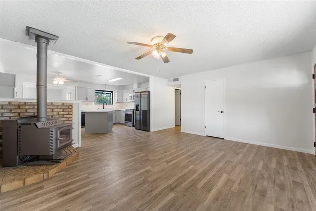 a view of a kitchen with a sink and a stove top oven