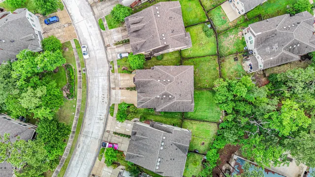 an aerial view of a house with outdoor space