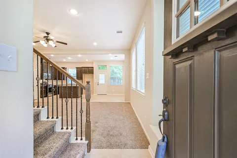 a view of a hallway with staircase