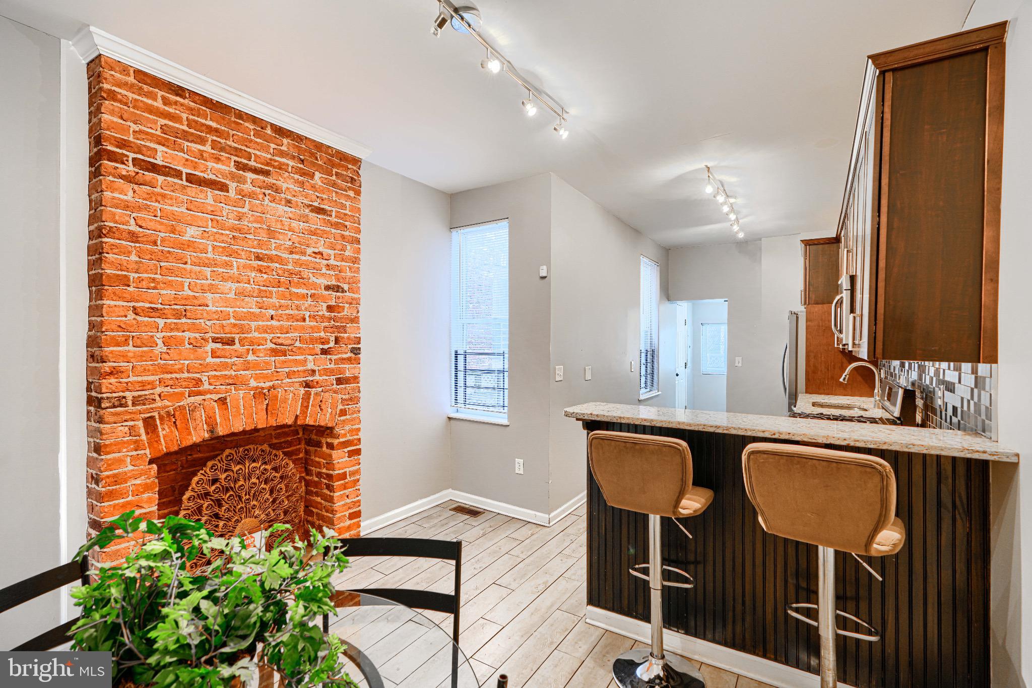1410 East Oliver Street Baltimore, MD 21213 - Photo 11 of 40 a view of a kitchen counter space and windows