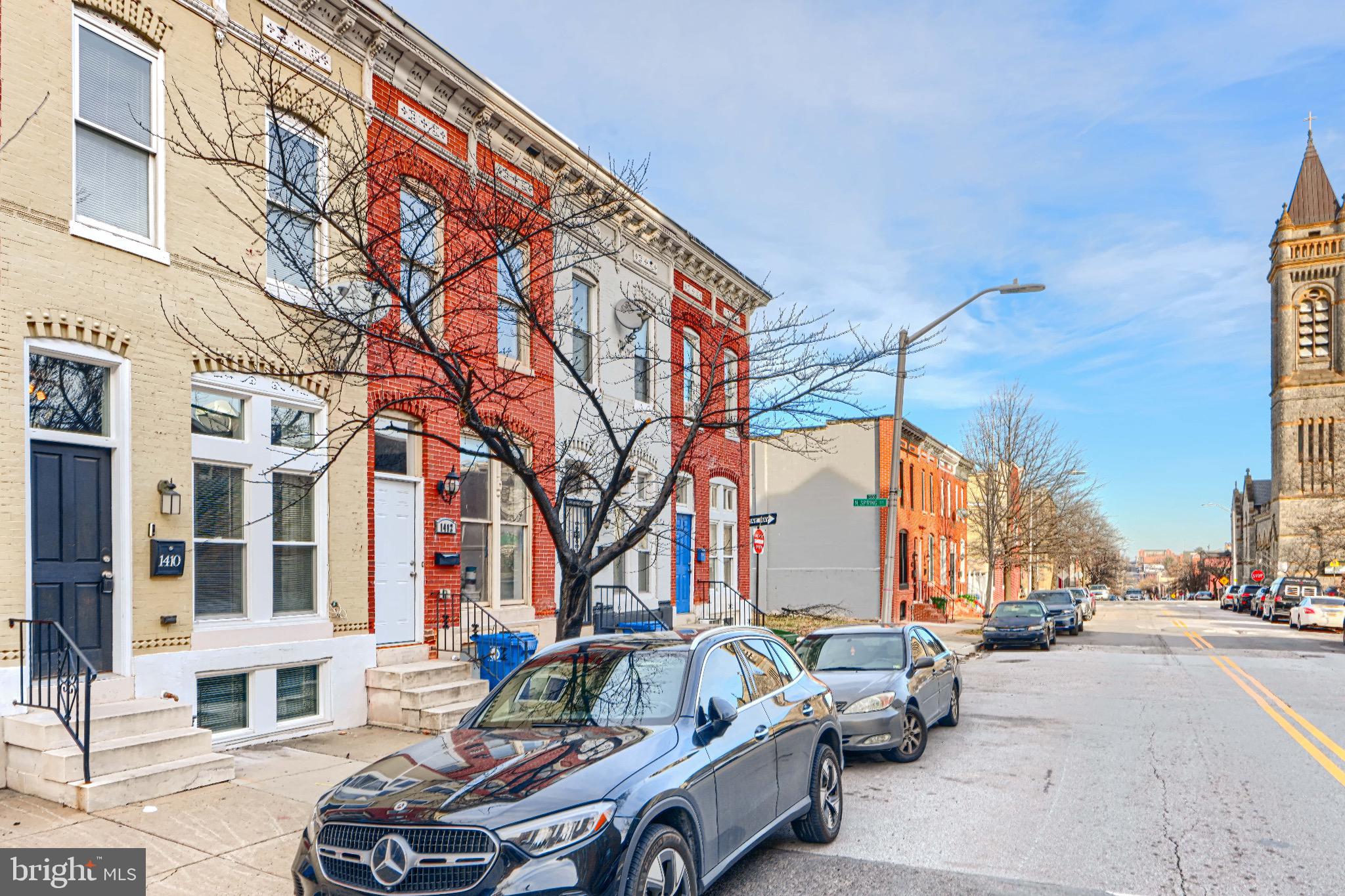 1410 East Oliver Street Baltimore, MD 21213 - Photo 4 of 40 a car parked in front of brick building