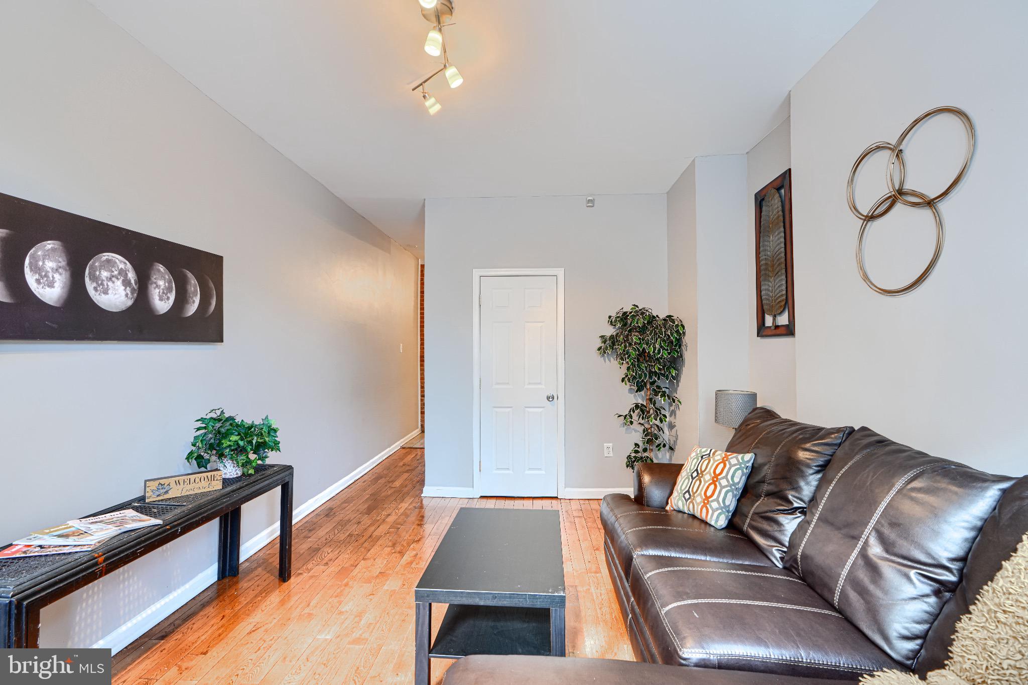 1410 East Oliver Street Baltimore, MD 21213 - Photo 6 of 40 a living room with furniture