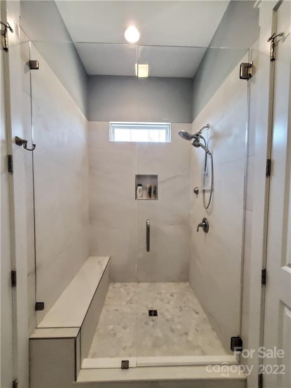 8596 Amandine Way Terrell, NC 28682 - Photo 16 of 25 a bathroom with a shower