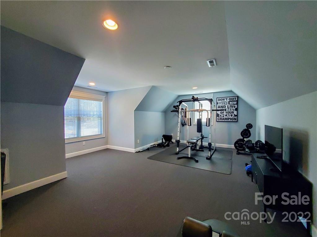 8596 Amandine Way Terrell, NC 28682 - Photo 22 of 25 a room with gym equipment and windows