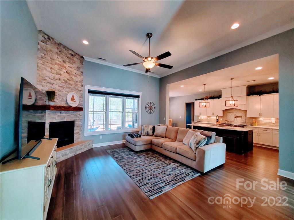 8596 Amandine Way Terrell, NC 28682 - Photo 5 of 25 a living room with fireplace furniture and a large window