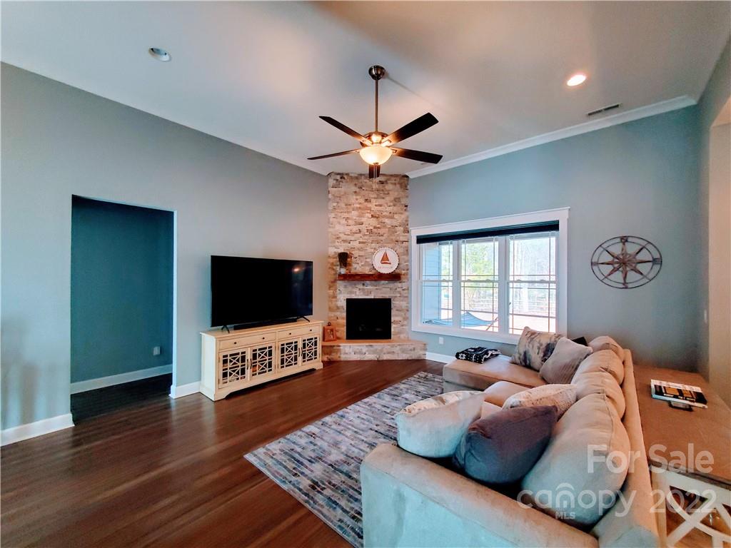 8596 Amandine Way Terrell, NC 28682 - Photo 6 of 25 a living room with fireplace furniture and a flat screen tv