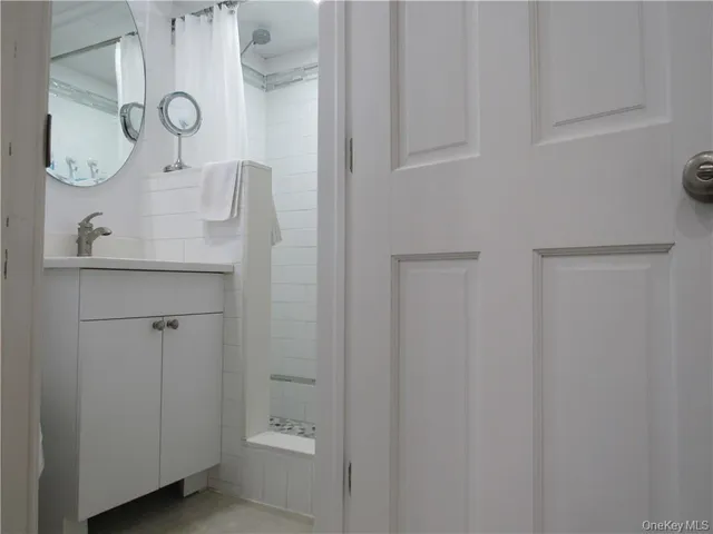 a bathroom with a sink and mirror