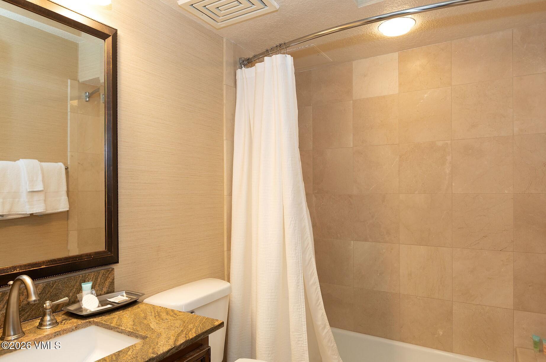 210 Offerson Road, Unit 41912 Beaver Creek, CO 81620 - Photo 18 of 28 a bathroom with a sink and a mirror