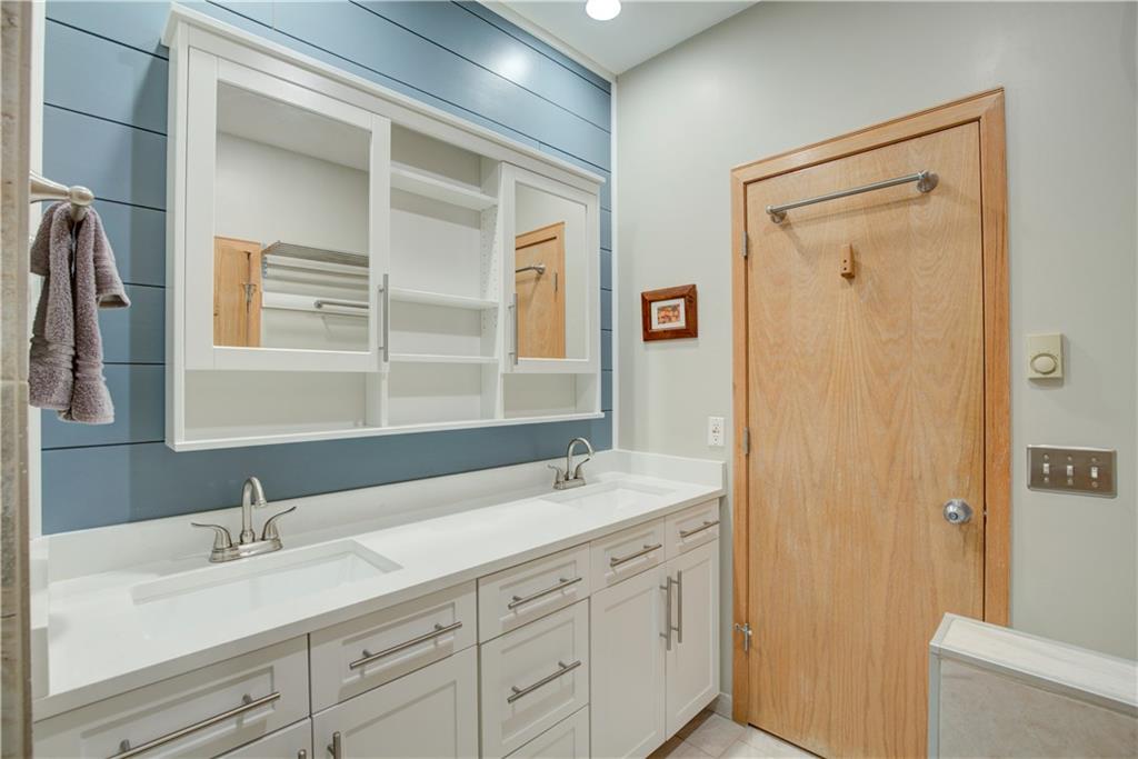 2017 Soda Ridge Road, Unit 1942 Keystone, CO 80435 - Photo 21 of 33 a bathroom with a granite countertop sink mirror and double