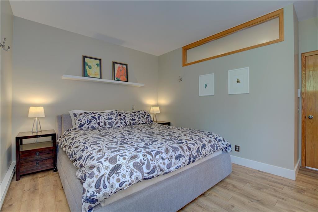 2017 Soda Ridge Road, Unit 1942 Keystone, CO 80435 - Photo 24 of 33 a large bed sitting in a bedroom next to a lamp