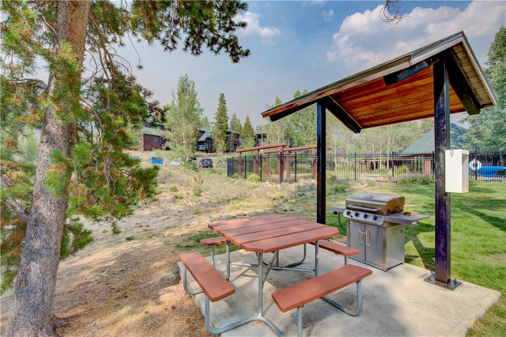 2017 Soda Ridge Road, Unit 1942 Keystone, CO 80435 - Photo 29 of 33 a backyard of a house with table and chairs