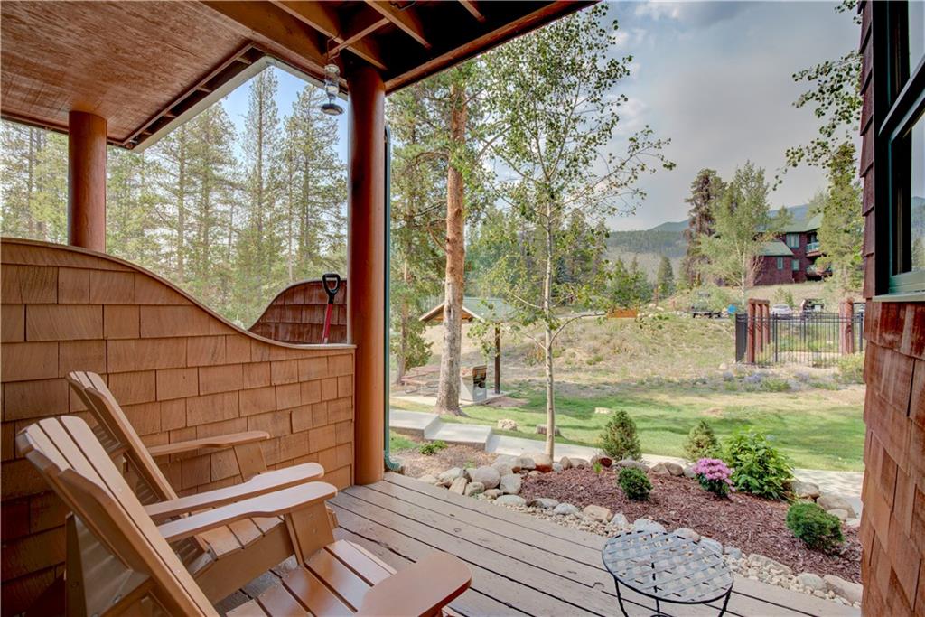 2017 Soda Ridge Road, Unit 1942 Keystone, CO 80435 - Photo 5 of 33 a view of a patio with chair and tables back yard of the house