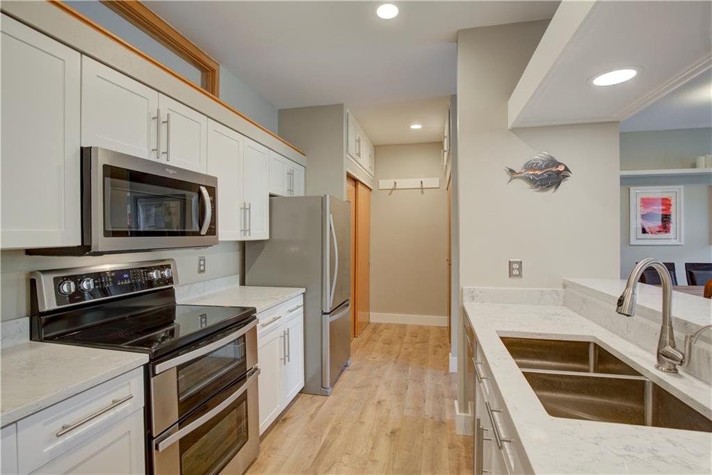 2017 Soda Ridge Road, Unit 1942 Keystone, CO 80435 - Photo 7 of 33 a kitchen with a sink stove and refrigerator