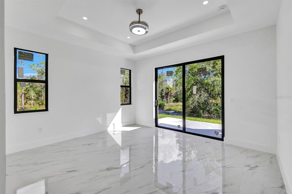 2002 East 10th Street Lehigh Acres, FL 33936 - Photo 14 of 25 a view of an empty room with a window