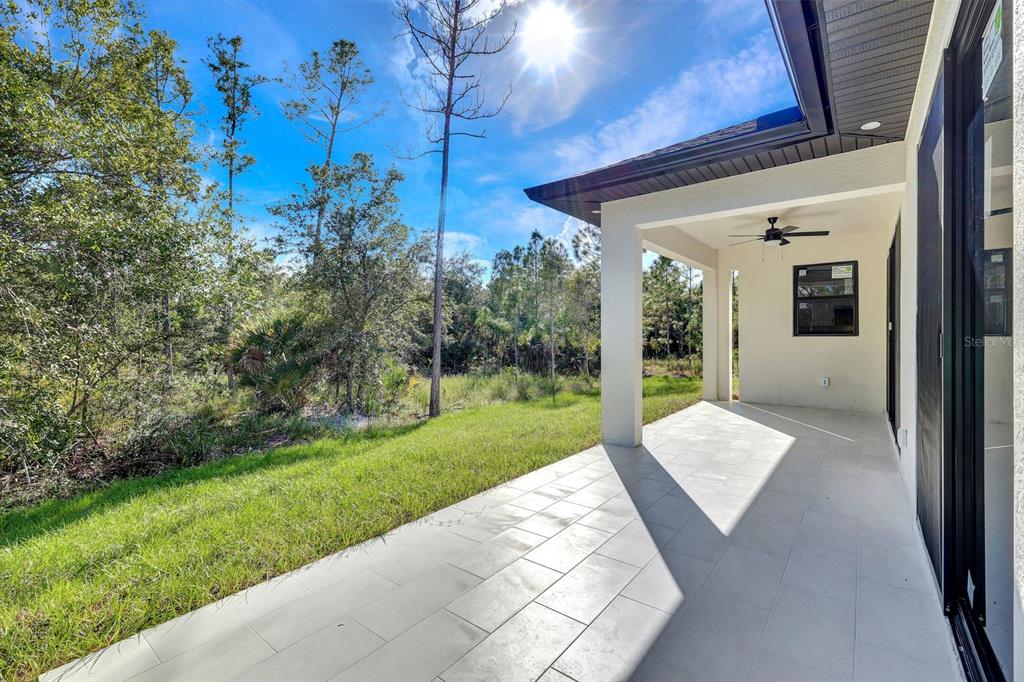 2002 East 10th Street Lehigh Acres, FL 33936 - Photo 22 of 25 a view of a porch with a backyard