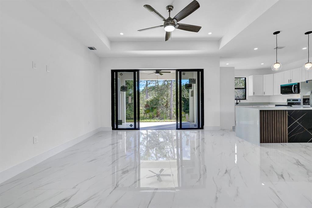 2002 East 10th Street Lehigh Acres, FL 33936 - Photo 5 of 25 a view of a kitchen with large windows