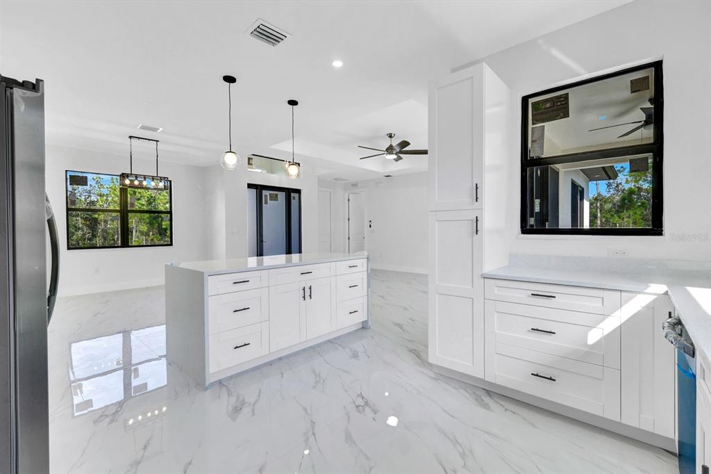 2002 East 10th Street Lehigh Acres, FL 33936 - Photo 10 of 25 a bathroom with a sink vanity and mirror