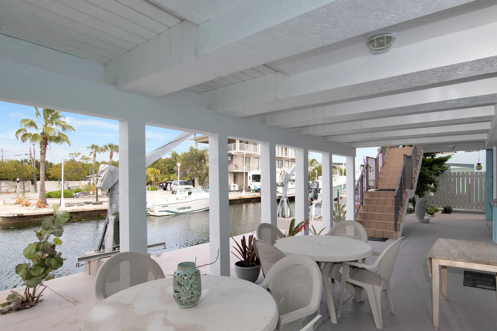 80 Seagate Boulevard Key Largo, FL 33037 - Photo 11 of 46 a dining room with furniture water view and large windows