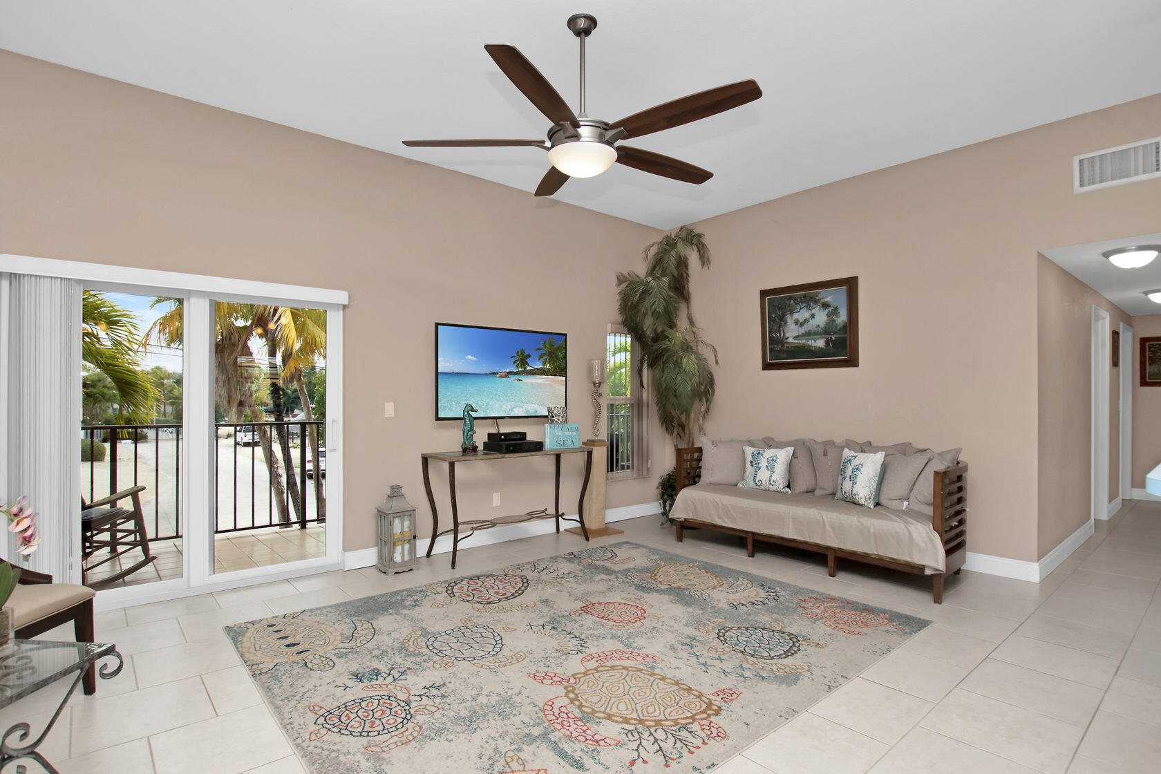 80 Seagate Boulevard Key Largo, FL 33037 - Photo 26 of 46 a living room with furniture and a large window