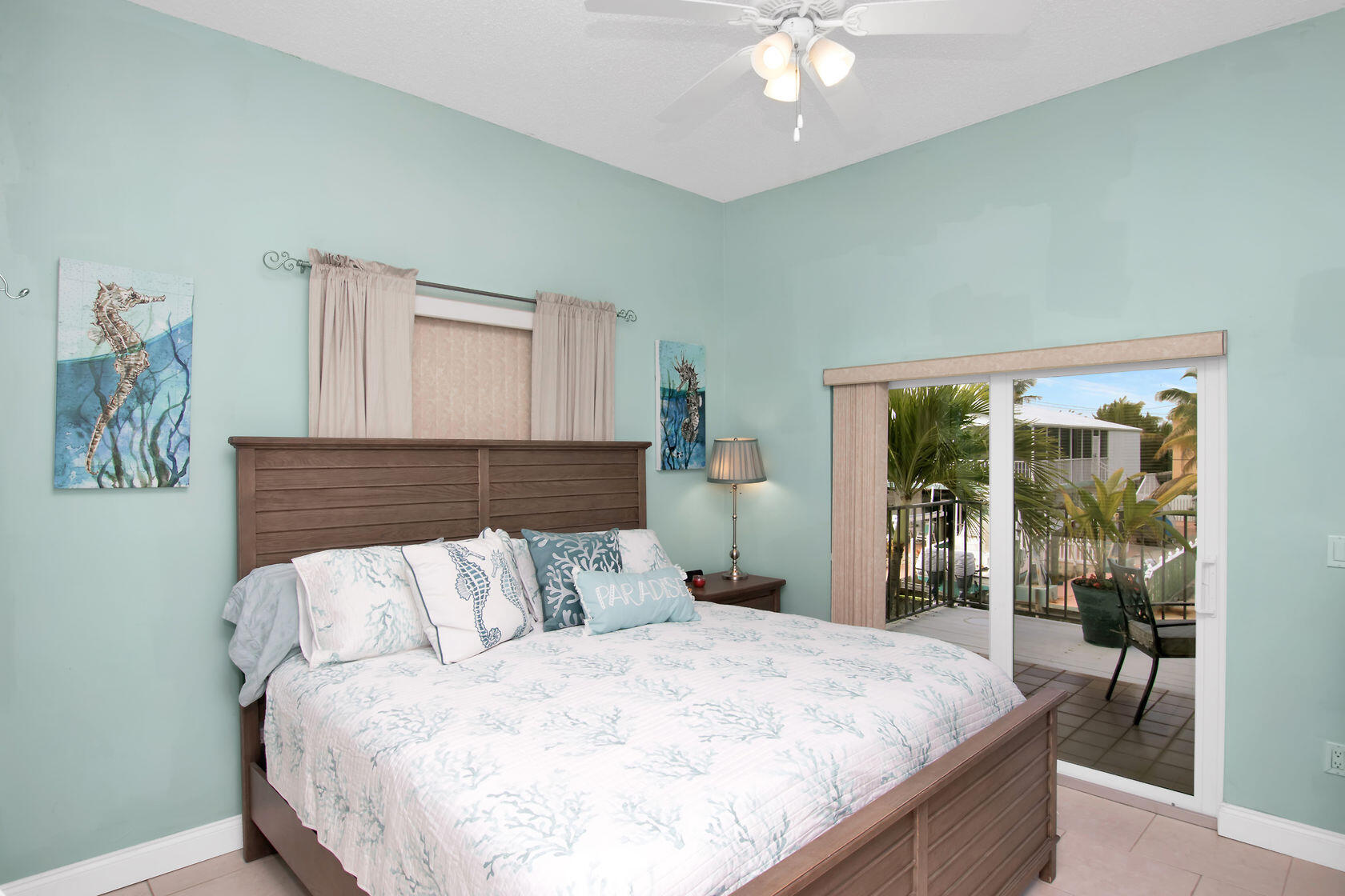 80 Seagate Boulevard Key Largo, FL 33037 - Photo 27 of 46 a bedroom with bed and window