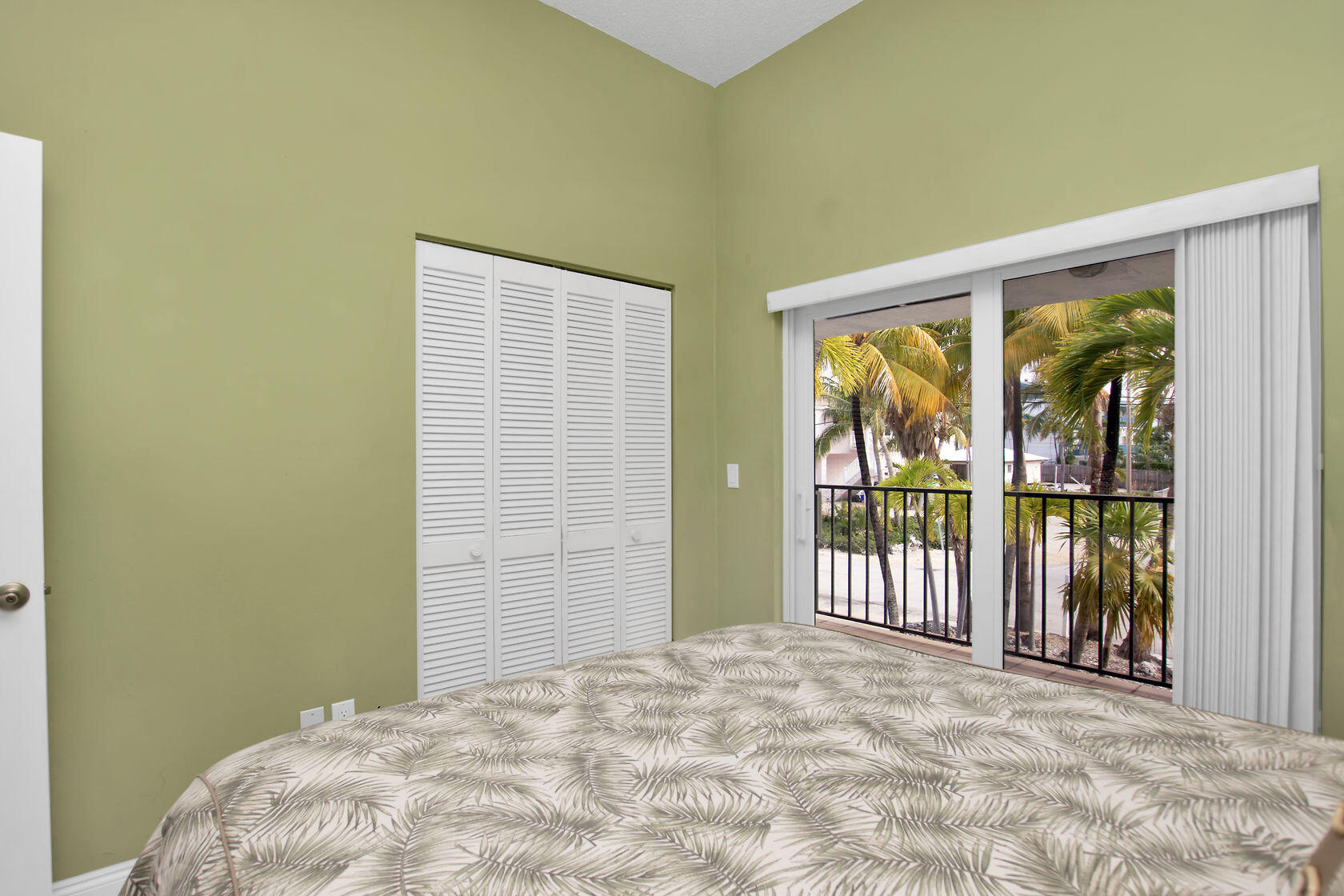 80 Seagate Boulevard Key Largo, FL 33037 - Photo 32 of 46 a view of a big room with windows and closet