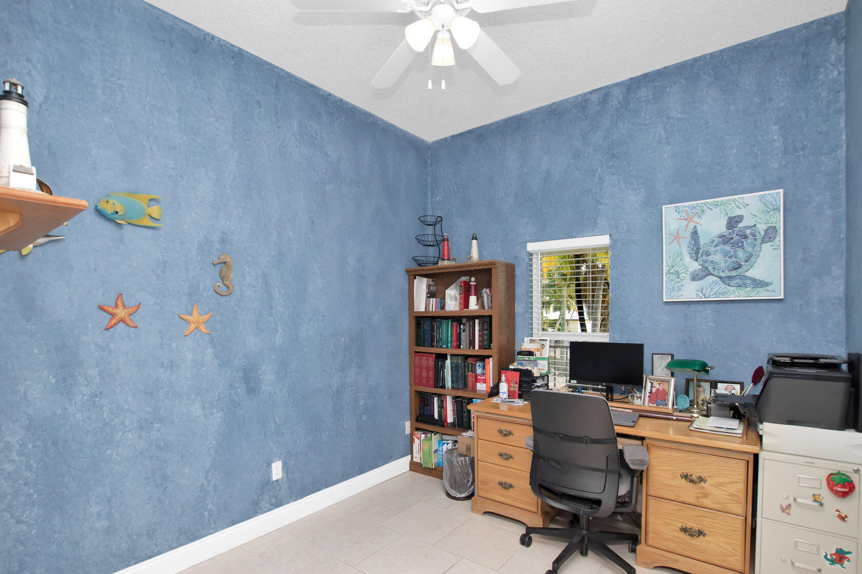 80 Seagate Boulevard Key Largo, FL 33037 - Photo 36 of 46 a view of a workspace with furniture and a window