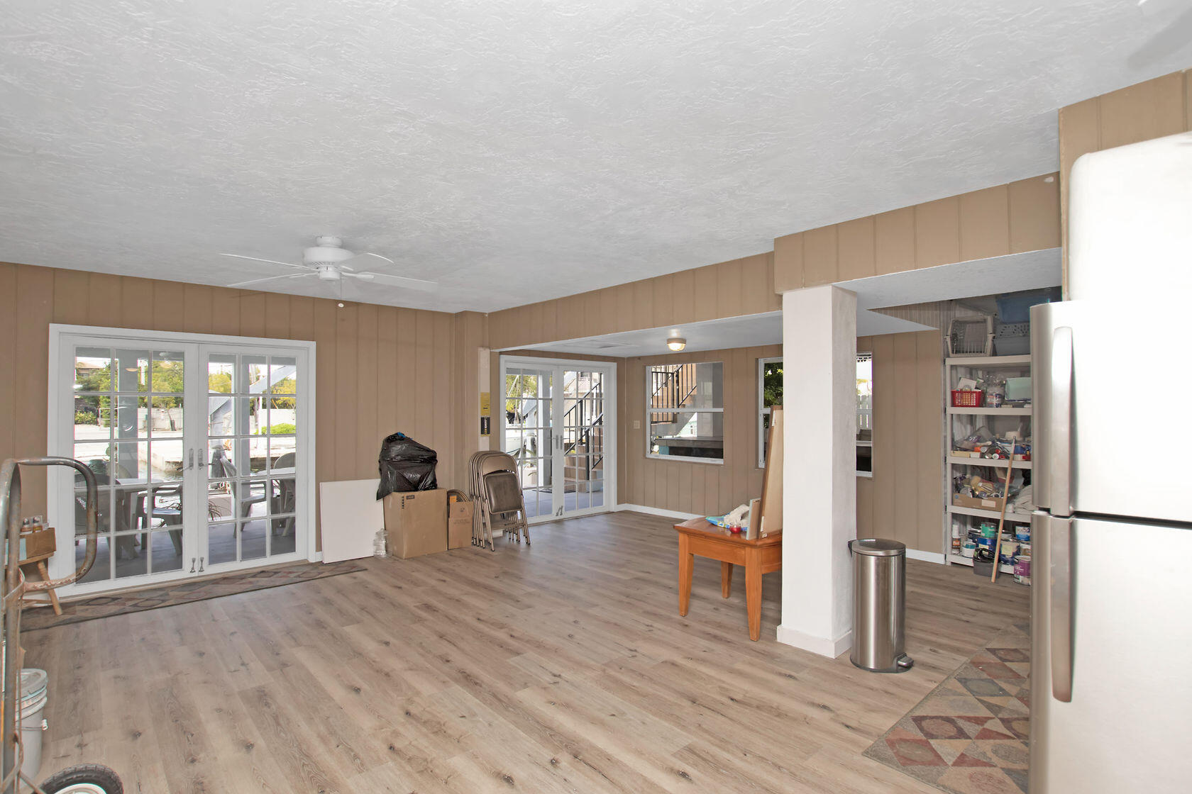 80 Seagate Boulevard Key Largo, FL 33037 - Photo 40 of 46 a view of a room with wooden floor and windows