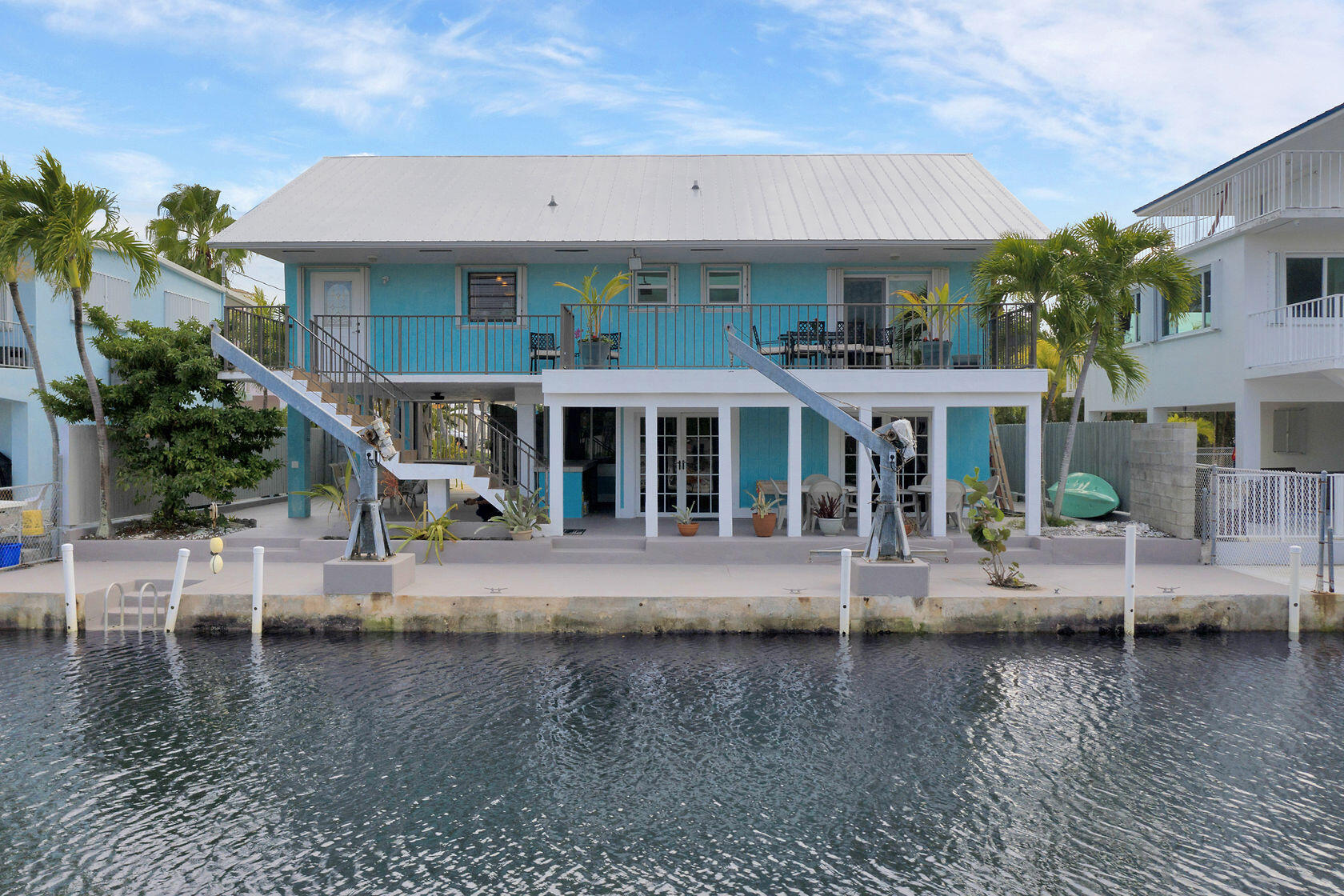 80 Seagate Boulevard Key Largo, FL 33037 - Photo 46 of 46 a front view of a house with a yard table and chairs