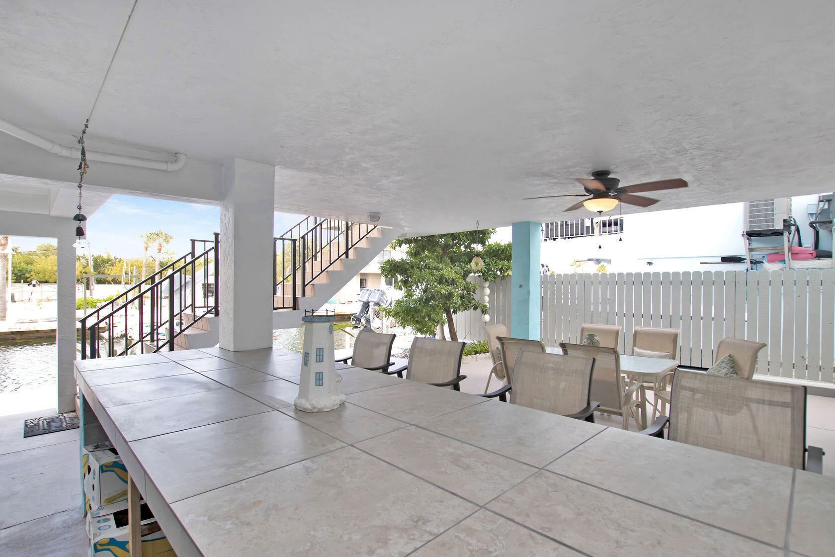 80 Seagate Boulevard Key Largo, FL 33037 - Photo 9 of 46 a view of a dining room with furniture window and outside view